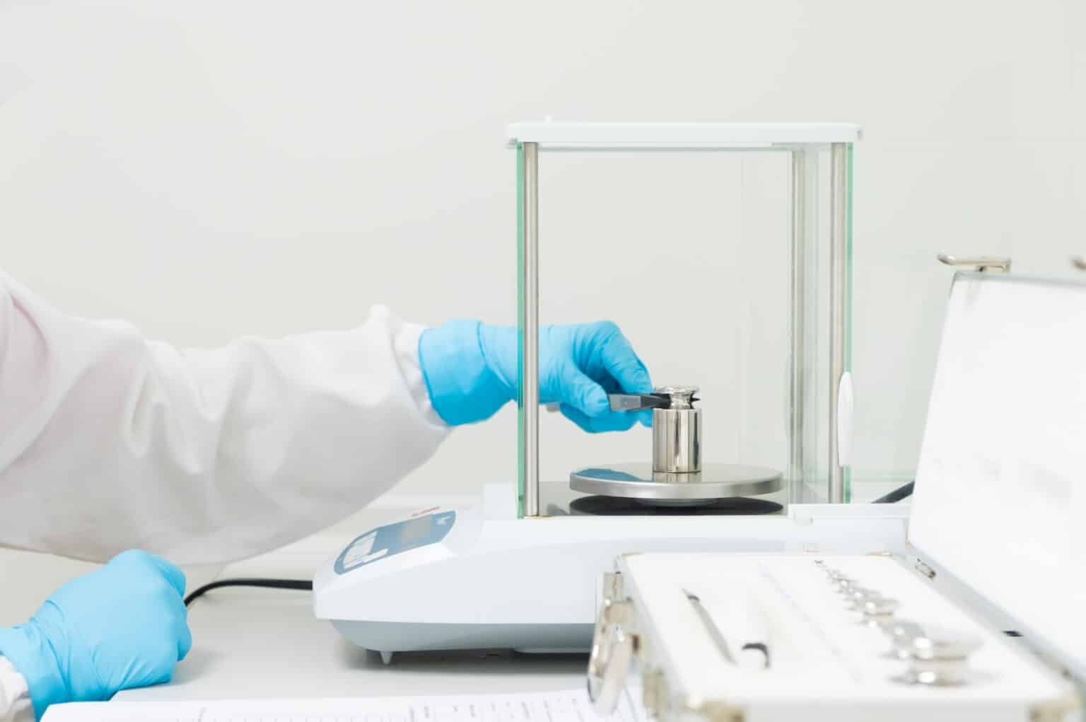 Technician reviewing calibration results for life sciences manufacturing equipment